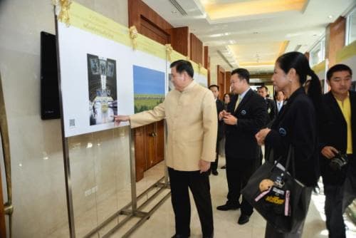 Granting the trophy award to the first runner and the second runner in the photo contest project of 
